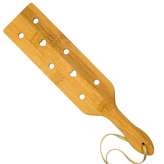 A wooden BDSM paddle with delicate dimensions for subtle yet impactful sensations.