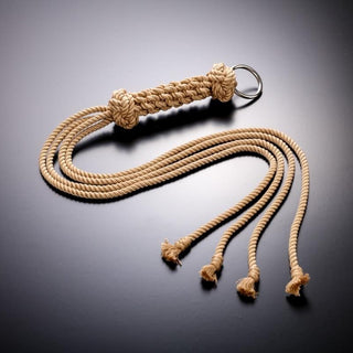 Take a look at an image of Handmade Whip Shibari Rope crafted from natural hemp strands with a thickened hemp handle for precise control.