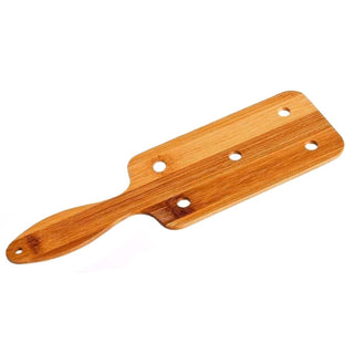 In the photograph, you can see an image of Impact Play BDSM Bamboo Wood Paddle Sex, a sturdy paddle crafted for dominance and submission play.