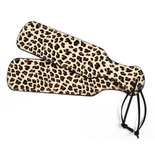 An image showcasing the 12.00 inches long and 2.95 inches wide animal-print paddle for sensory exploration.