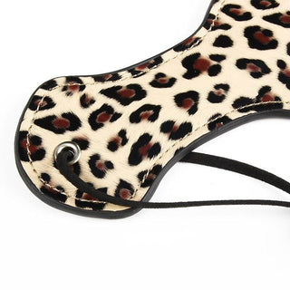 View the luxurious and safe indulgence of the PU leather Cool Leopard-Printed SM Spanking Toy.