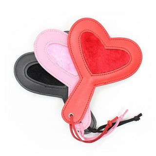 Here is an image of Charming Slap Kink Plushy Heart Sex Paddle in sultry red color with plush material and PU leather lining.