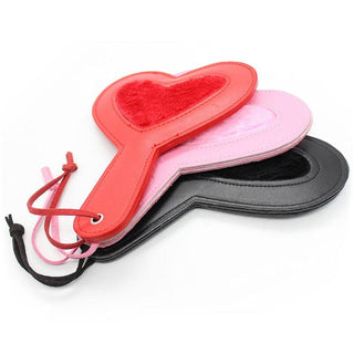 Displaying an image of Charming Slap Kink Plushy Heart Sex Paddle featuring a luxurious mix of plush material and PU leather for tactile sensations.