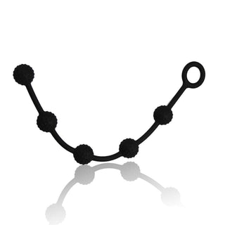 A close-up image of the 0.55 inch diameter silicone anal beads strung along a 9.45 inch length.