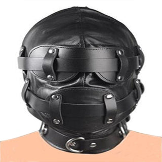 This is an image of Ultimate Slave Punishment Leather Hood, highlighting the sensory deprivation eye pad and the 3.74-inch dildo gag for absolute submission.