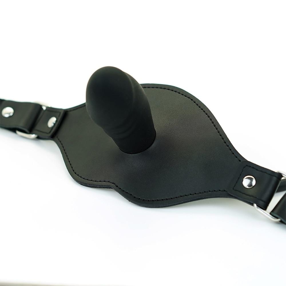Displaying an image of Pump It Up Gag specifications: Color - Black, Material - Strap: Faux Leather, Dildo Gag: Silicone, Dimensions - Strap: 16.5-22.5 inches, Dildo: 2.95 inches, Panel: 8.27 inches.