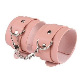 Observe an image of Elegant Leather Sex Cuffs for Bondage Restraints in Pink, designed for luxury and comfort.
