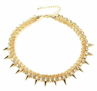 You are looking at an image of Shiny Shimmering Spiked Collar in gold and silver colors with dazzling gems and daring spikes.