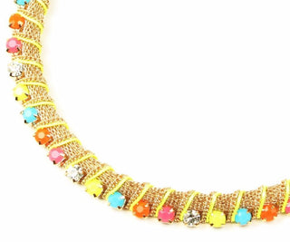 Adjustable choker collar featuring ornate design with colorful gems and secure lobster clasp.