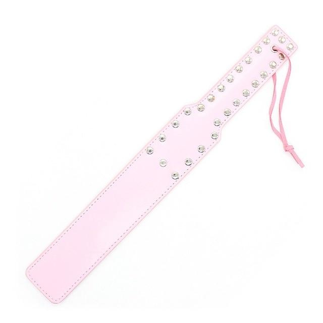 A luxurious BDSM slave beater spanking paddle made of high-quality PU leather for a firm yet smooth sensation.
