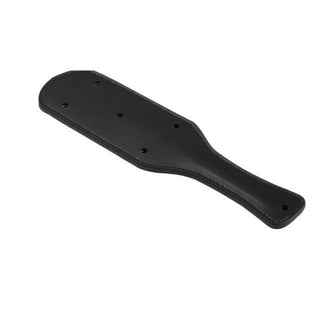 Check out an image of Badass Leather Spanking Paddle, featuring unique holes for faster and more intense swings during BDSM impact play.