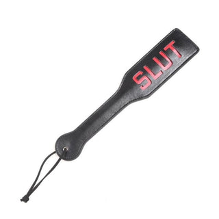 Feast your eyes on an image of Slave Shaming Slut Sex Paddle with a bold crimson slut engraving for delightful discipline play.