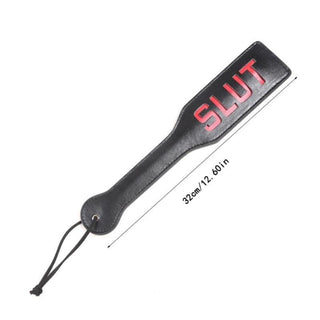 A picture of Slave Shaming Slut Sex Paddle, featuring a provocative slut engraving in fiery, crimson letters for a tantalizing spanking session.
