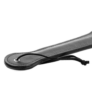 This is an image of Slave Shaming Slut Sex Paddle, crafted from PU leather with a sturdy handle for comfortable grip and precise spanking.