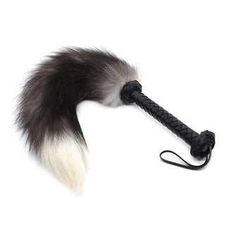 Observe an image of Sexy Rabbit Fur Flogger Whip with Leather Handle, a luxurious accessory for sensual play.