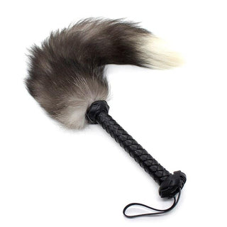 This is an image of Gray and White Tail Flogger with Leather Handle, designed for a symphony of sensations.