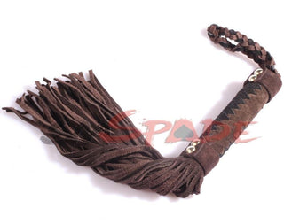 In the photograph, you can see an image of Torture Play Whip Suede Kink Toy, a faux suede flogger with hypoallergenic strands for various pain levels.