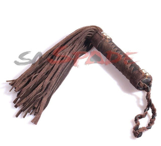 This is an image of Torture Play Whip Suede Kink Toy, a premium faux suede flogger for safe and satisfying sensory play experiences.