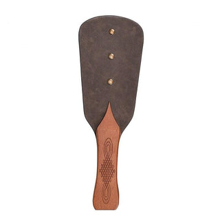 Detailed shot of BDSM Femdom Solid Pine Wood Paddle with cowhide blade for impact play.