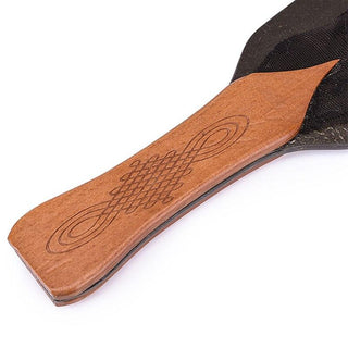 Close-up of BDSM Femdom Solid Pine Wood Paddle handle made from durable pine wood.