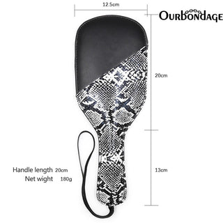 Experience the wild desires with this image of the unique paddle, perfect for both teasing and disciplining.