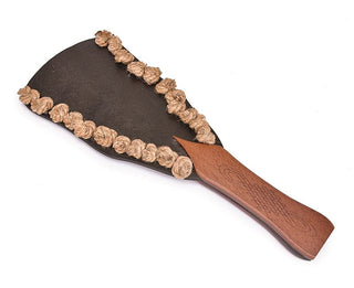 Vintage Style Bondage Wood Paddle Handle: This is an image of a BDSM paddle with a dual-sided design, featuring smooth leather on one side and knotted ramie rope on the other.