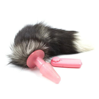 This is an image of Seductive Vibrating Pink Plastic Tail Plug with remote-controlled vibrator for adjustable sensations.