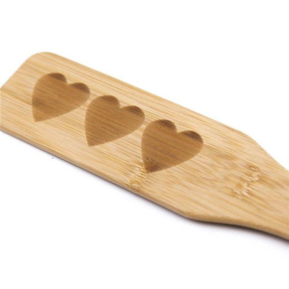 A wooden paddle measuring 12.48 inches in length and 2.17 inches in diameter for precise control.