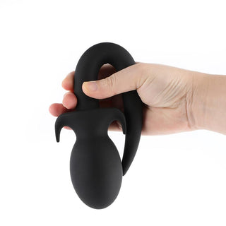 This is an image of Black Rounded Silicone Dog Tail Plug 9 to 10 Inches Long with a rounded, swollen head for unique sensations.