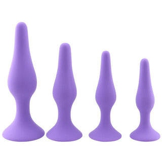 In the photograph, you can see an image of black and purple silicone plugs with suction bases for hands-free play.