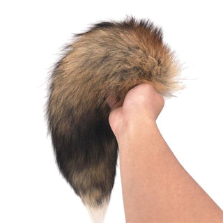 Here is an image of Faux Brown Fox Cat Fur Plug with sizes ranging from small to large for a customized fit.
