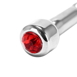 View the luxurious design of Thick Jewelled Penis Plug, made of polished stainless steel for a smooth touch and hypoallergenic properties.