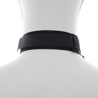 This is an image of a BDSM collar accessory tailored for total surrender, with adjustable features for a snug and comfortable fit during thrilling dominance play.